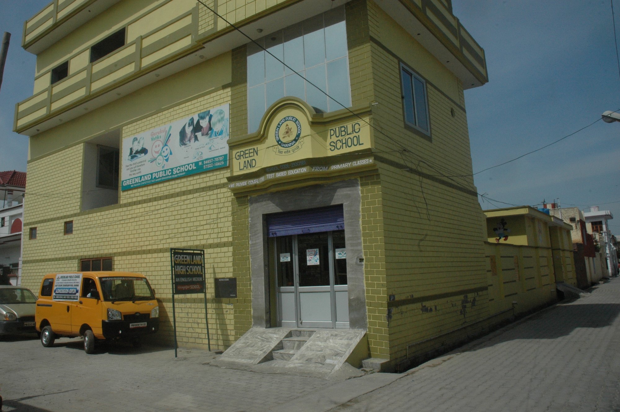 School entrance with van