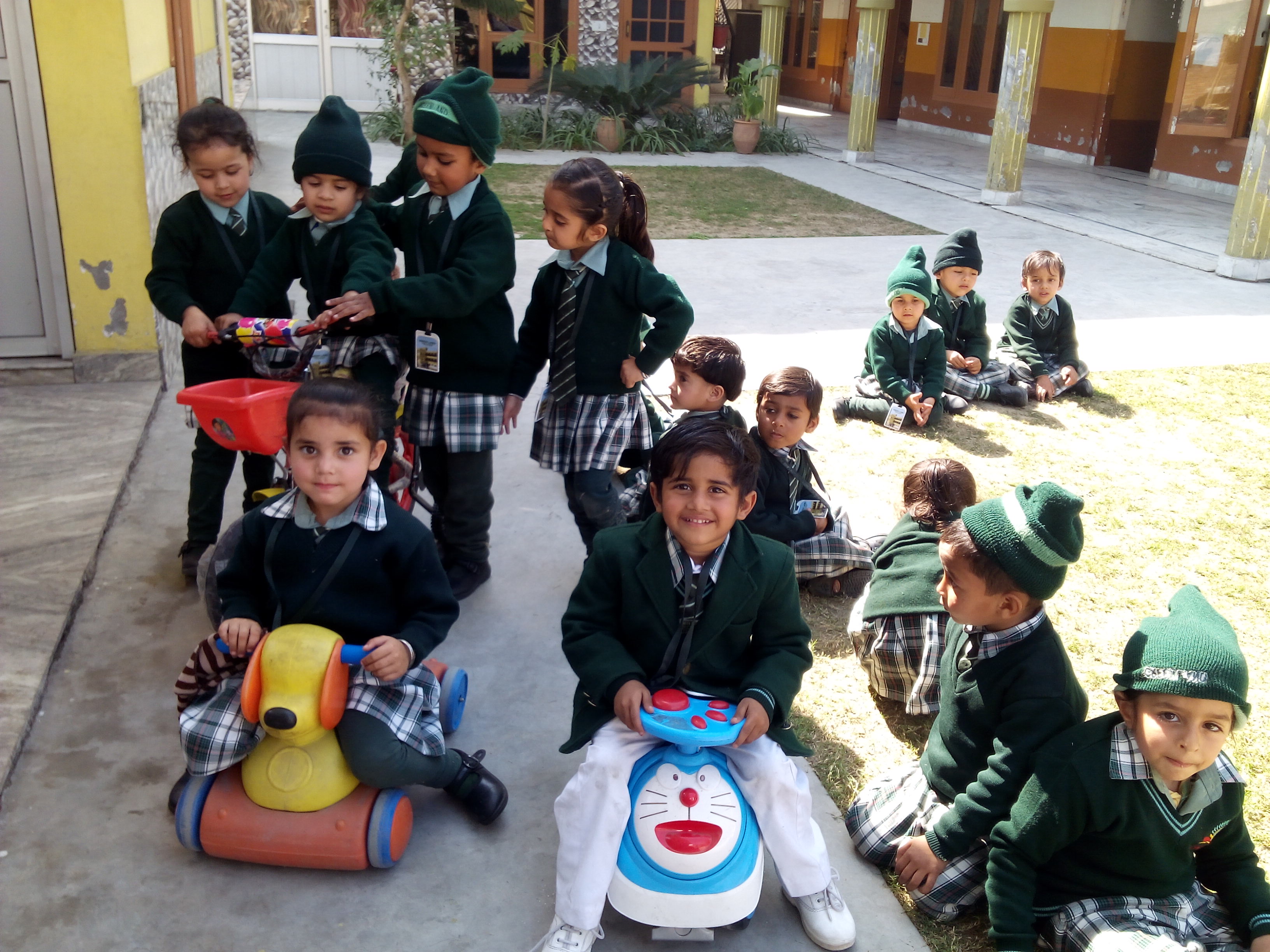 Ride-on toys in courtyard