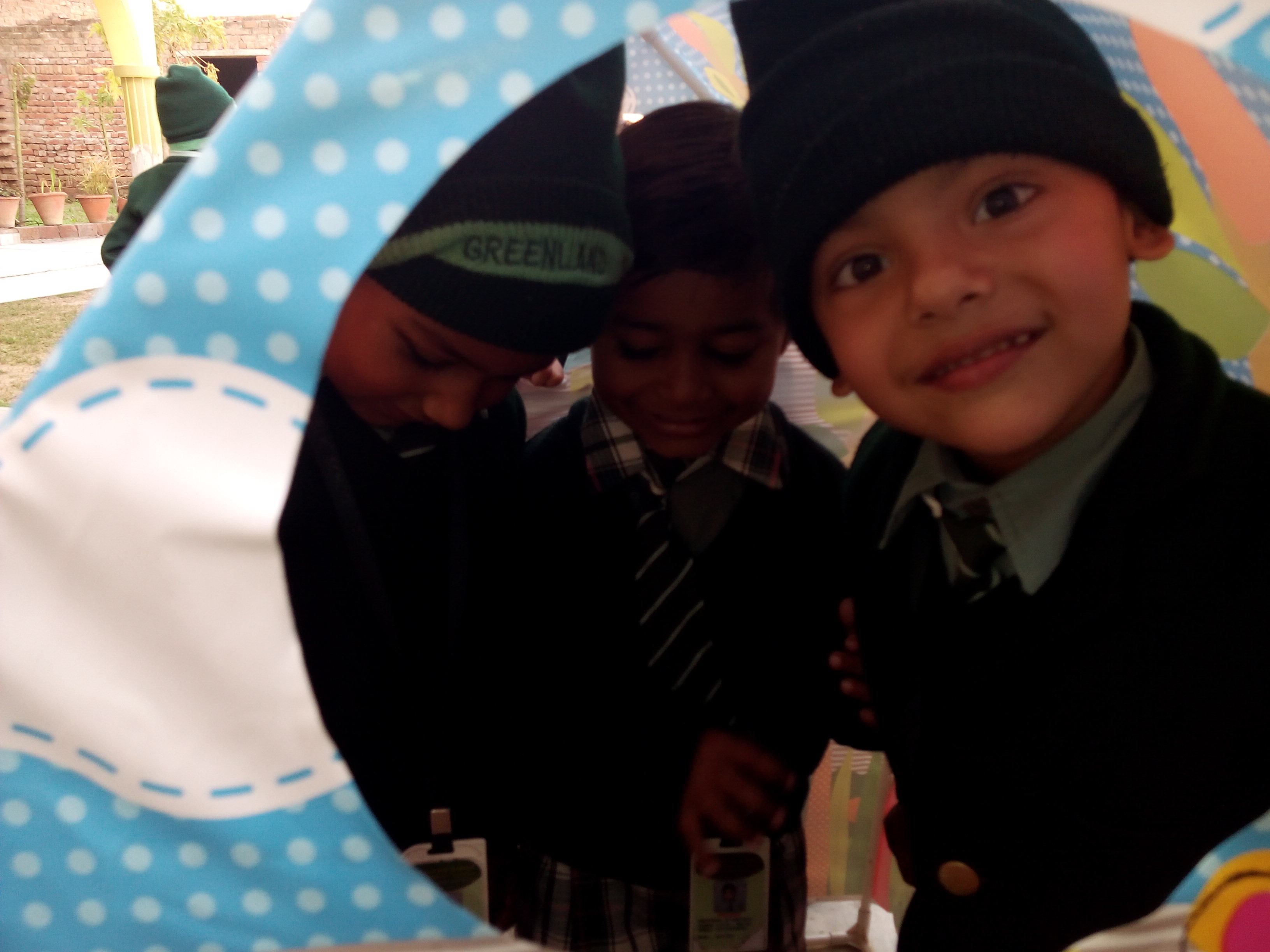 Children peeping through ring