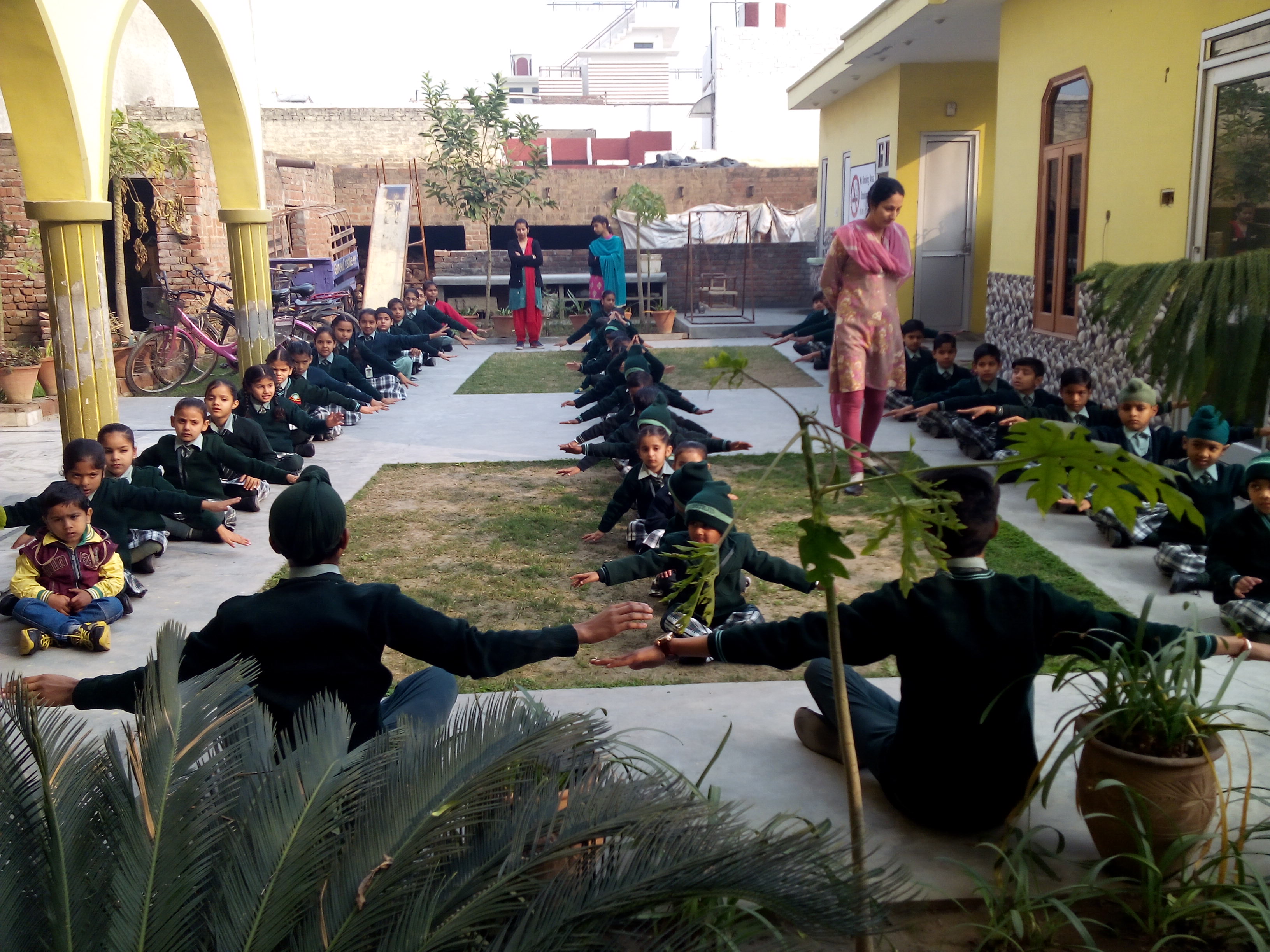 Yoga stretching in courtyard